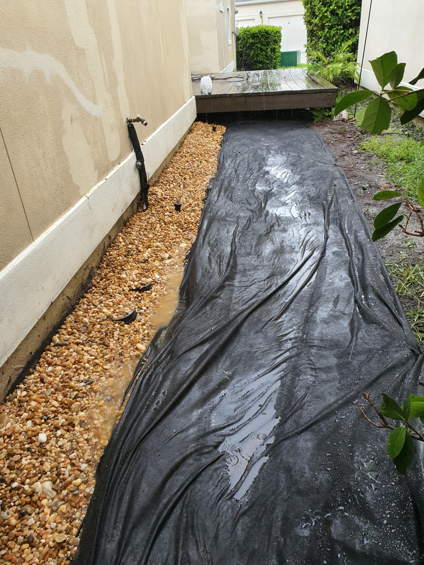 Drainage channel installation in a yard.