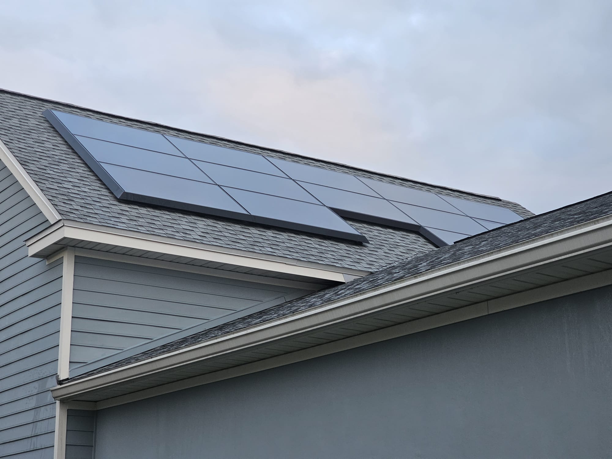 Rooftop solar panels after professional soft-wash cleaning, clean and reflective.